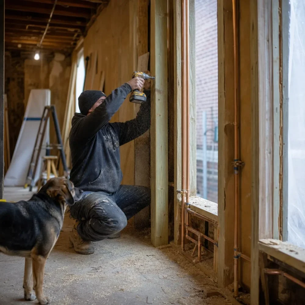 general-contractor-framing-renovation-philadelphia General contractor framing a stud wall during renovation in a Philadelphia rowhome