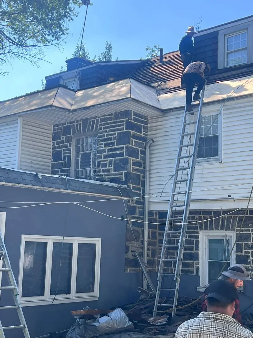 Slate roof replacement and dormer repair on a stone home in Montgomery County by Affinity Contractors