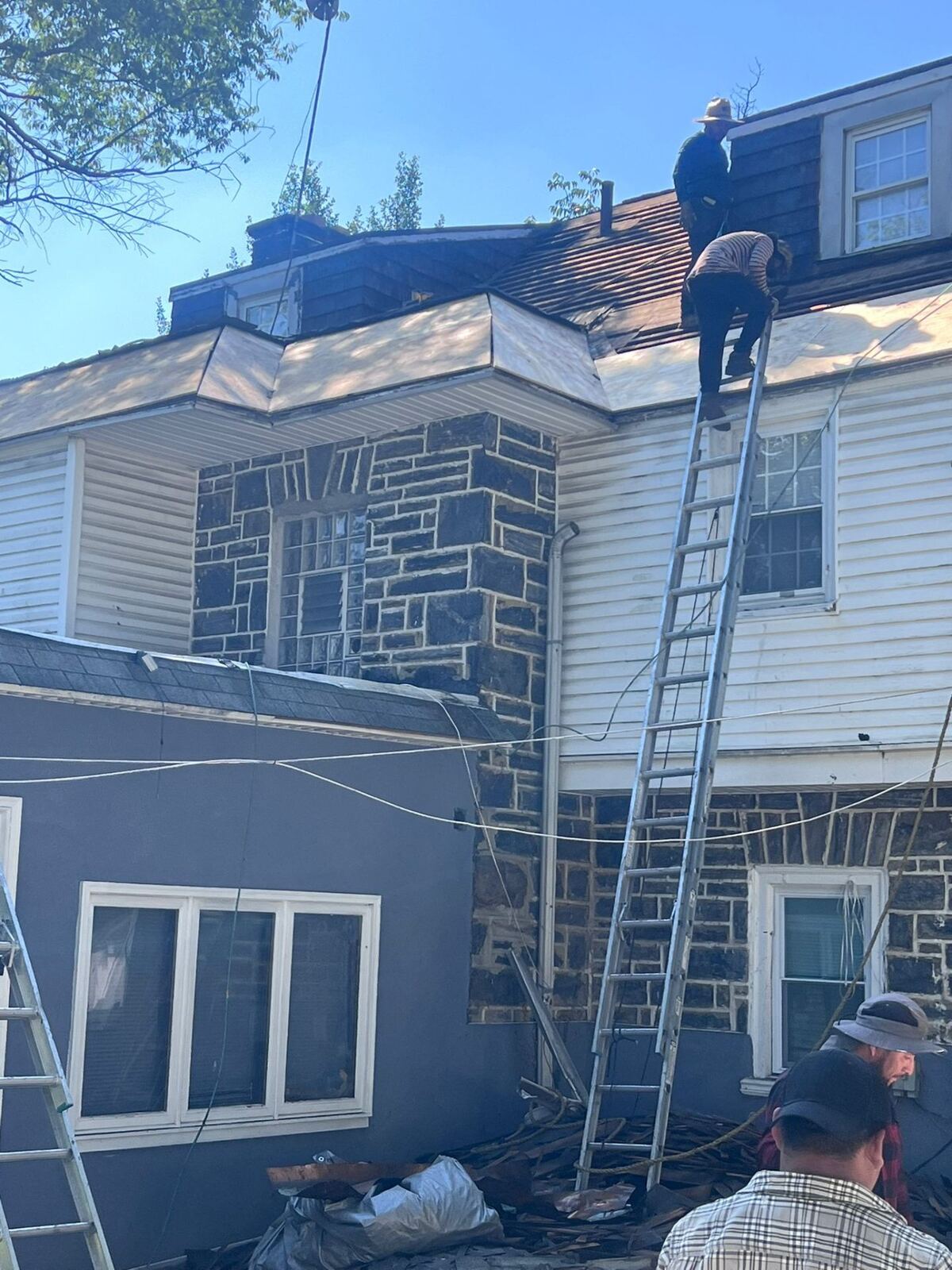 Slate roof replacement and dormer repair on a stone home in Montgomery County by Affinity Contractors